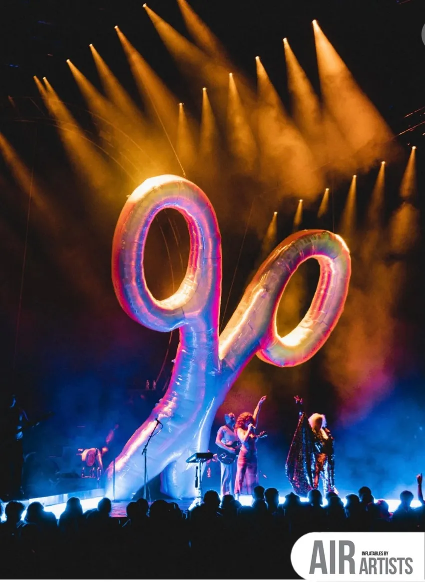 Giant Scissor Sisters Inflatable In Front of a Big Crowd