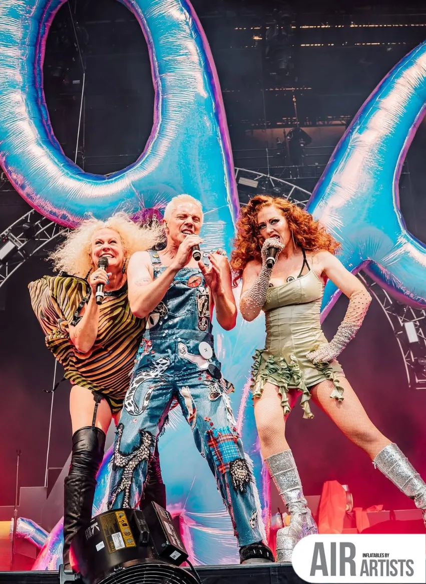 Iridescent Scissors Inflatable For the Scissor Sisters' who are seen singing on stage in front of them